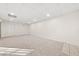 Spacious basement featuring tile accents, neutral carpet, and ample recessed lighting at 179 Hunters Crk, Dallas, GA 30157