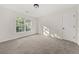 Well lit bedroom features carpeted floors and a bright window with natural light at 179 Hunters Crk, Dallas, GA 30157