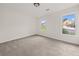 Bedroom features neutral carpet, two windows providing lots of natural light and a view of the neighborhood at 179 Hunters Crk, Dallas, GA 30157
