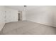 A secondary bedroom has neutral carpet and white doors at 179 Hunters Crk, Dallas, GA 30157