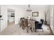 Cozy dining room with neutral colors, views to kitchen, and an inviting chair in the corner at 179 Hunters Crk, Dallas, GA 30157