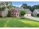 Charming brick home with manicured lawn, two-car garage and beautiful curb appeal at 179 Hunters Crk, Dallas, GA 30157