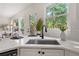 Kitchen with ample countertop space, modern sink and view of outdoor living space at 179 Hunters Crk, Dallas, GA 30157