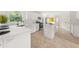 Bright kitchen featuring white cabinets, an island, and eat-in kitchen with lots of natural light at 179 Hunters Crk, Dallas, GA 30157