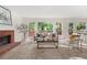 Bright living room with fireplace, plush carpet and views of outdoor deck at 179 Hunters Crk, Dallas, GA 30157