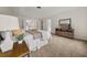 Neutral main bedroom features carpeted floors and a dresser with matching bedside tables at 179 Hunters Crk, Dallas, GA 30157