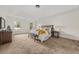 Spacious main bedroom with tray ceilings, carpeted floor, and natural light from bright windows at 179 Hunters Crk, Dallas, GA 30157
