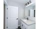 Bathroom features a single sink vanity with granite countertop and black fixtures at 1174 Donnelly Sw Ave, Atlanta, GA 30310
