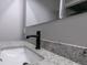 Bathroom sink featuring granite counters, undermount sink, and modern fixtures at 1174 Donnelly Sw Ave, Atlanta, GA 30310