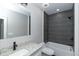 Bathroom featuring a tub/shower combo with tile surround and granite-topped vanity at 1174 Donnelly Sw Ave, Atlanta, GA 30310