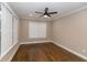 This bedroom features hardwood floors, fresh paint, and a ceiling fan at 1174 Donnelly Sw Ave, Atlanta, GA 30310