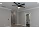 Spacious bedroom featuring neutral paint, trim, carpet, and a modern ceiling fan at 1174 Donnelly Sw Ave, Atlanta, GA 30310