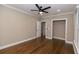 Bedroom includes hardwood flooring, a ceiling fan, closet, and an ensuite bathroom at 1174 Donnelly Sw Ave, Atlanta, GA 30310