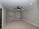 Comfortable, carpeted bedroom features updated ceiling fan and natural light at 1174 Donnelly Sw Ave, Atlanta, GA 30310