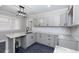 Bright kitchen with granite counters, black faucet, grey cabinets, and subway tile backsplash at 1174 Donnelly Sw Ave, Atlanta, GA 30310