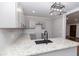 Well-appointed kitchen with granite counters, black faucet, updated cabinetry, and subway tile backsplash at 1174 Donnelly Sw Ave, Atlanta, GA 30310