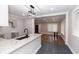 Contemporary kitchen with granite countertops, dark tile flooring, and stainless steel faucet; open to the dining room at 1174 Donnelly Sw Ave, Atlanta, GA 30310