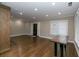Open-concept living area with hardwood flooring, wood accents and neutral wall paint at 1174 Donnelly Sw Ave, Atlanta, GA 30310