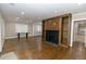 Living room with hardwood floors, a fireplace with built-ins, and lots of natural light at 1174 Donnelly Sw Ave, Atlanta, GA 30310