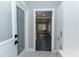 Stylish mudroom with a decorative laundry door, tile flooring, and cabinets at 1174 Donnelly Sw Ave, Atlanta, GA 30310
