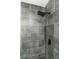 Modern tiled shower featuring gray subway tile and a rainfall shower head at 1174 Donnelly Sw Ave, Atlanta, GA 30310