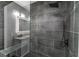 Tiled walk-in shower featuring a built-in bench and sleek fixtures at 1174 Donnelly Sw Ave, Atlanta, GA 30310