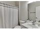 Bathroom with shower curtain, vanity, and toilet at 1614 Summersweet Ln, Dacula, GA 30019