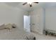 Comfortable bedroom with neutral tones, plush bedding, ceiling fan, and closet space at 1614 Summersweet Ln, Dacula, GA 30019