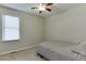 Bedroom featuring a ceiling fan and a window at 1614 Summersweet Ln, Dacula, GA 30019