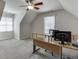 Finished room with large desk setup and natural light from two windows at 1614 Summersweet Ln, Dacula, GA 30019