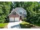 Charming brick two-story home with a two-car garage and lush landscaping at 1614 Summersweet Ln, Dacula, GA 30019