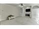 Spacious living room featuring a fireplace, built-in shelving, and neutral carpet at 1614 Summersweet Ln, Dacula, GA 30019