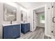 Bathroom features a walk-in closet and double vanities at 1943 Lake Chase Ln, Jonesboro, GA 30236