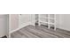Walk-in closet with door and custom built-in shelving at 1943 Lake Chase Ln, Jonesboro, GA 30236