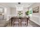 Elegant dining room with modern light fixture and built-in shelving at 1943 Lake Chase Ln, Jonesboro, GA 30236
