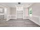 Bright dining room featuring modern lighting and custom built-in cabinets at 1943 Lake Chase Ln, Jonesboro, GA 30236