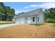 Exterior view of house with attached garage at 1943 Lake Chase Ln, Jonesboro, GA 30236