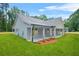 Beautiful home with side porch, landscaping, and a well-maintained lawn at 1943 Lake Chase Ln, Jonesboro, GA 30236