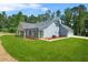 Spacious home with attractive curb appeal, side lawn, and garage at 1943 Lake Chase Ln, Jonesboro, GA 30236