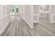 Hallway boasting hardwood floors and neutral colors at 1943 Lake Chase Ln, Jonesboro, GA 30236