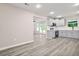 Open-concept kitchen with stainless steel appliances and gray cabinets at 1943 Lake Chase Ln, Jonesboro, GA 30236