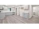 Well-lit kitchen with gray cabinets, stainless appliances, and ample counter space at 1943 Lake Chase Ln, Jonesboro, GA 30236
