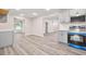 A modern kitchen boasts gray cabinets, stainless steel appliances, and wood-look floors at 1943 Lake Chase Ln, Jonesboro, GA 30236