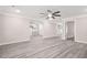 This living room features a ceiling fan, open floor plan, and lots of natural light at 1943 Lake Chase Ln, Jonesboro, GA 30236