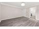 Bright room with an elegant chandelier, a door, and white trim at 1943 Lake Chase Ln, Jonesboro, GA 30236