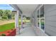 Inviting side porch with brick accents and ample natural light at 1943 Lake Chase Ln, Jonesboro, GA 30236