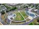 An aerial view displays a well maintained park with a walking path, green space, and parking at 3415 Crop Corner Rd, Suwanee, GA 30024