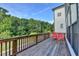 A spacious back deck with seating offers a serene spot to relax and enjoy the view at 3415 Crop Corner Rd, Suwanee, GA 30024