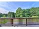 A spacious back deck with seating offers a serene spot to relax and enjoy the view at 3415 Crop Corner Rd, Suwanee, GA 30024
