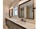 Bright bathroom featuring double sinks, tiled flooring, and glass enclosed shower at 3415 Crop Corner Rd, Suwanee, GA 30024